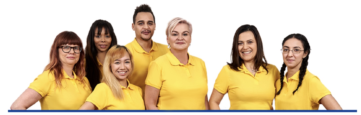 Team der Häuslichen Krankenpflege Phillips in gelben Dienstshirts